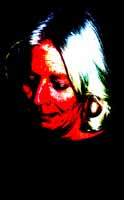 Grieving is the process of accepting loss. Photo of a woman in grief by Carl Benedict.